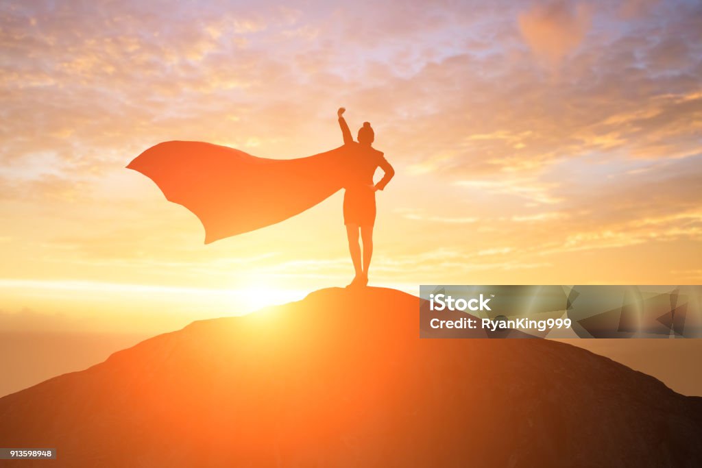 super business woman on mountain silhouette of super business woman look somewhere on the mountain Women Stock Photo