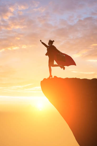 istock super business woman on mountain 913599086