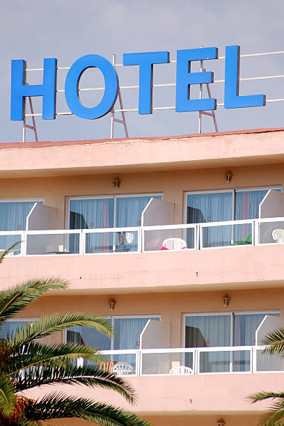 istock spanish hotel balconies and blue sign 91360173