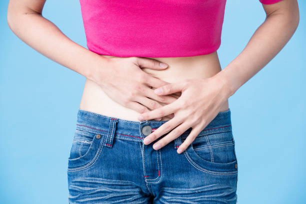istock woman touch her belly 913602754
