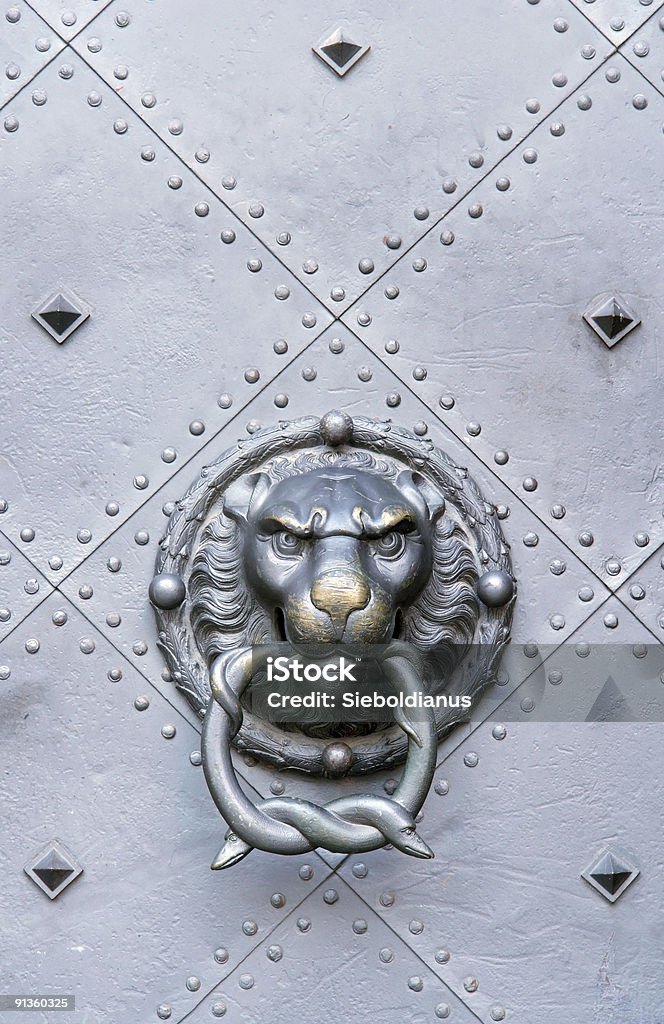 Medieval door knocker, used up.  Door Knocker Stock Photo