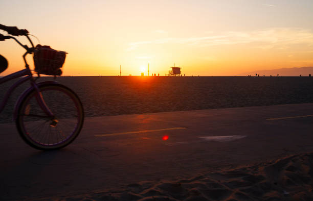 istock bicycle ride at sunset on the beach 913608452
