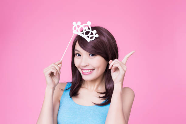 istock woman holding paper party sticks 913609288