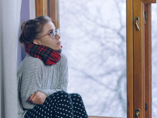 istock Girl in a scarf and glasses 913612872