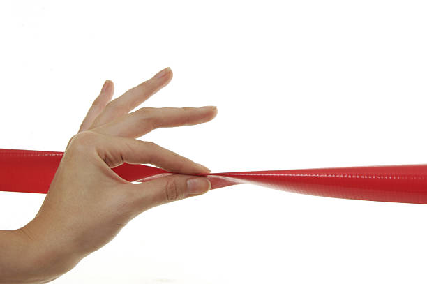 istock Hand pinching red tape 91361328