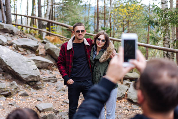istock guy and girl are posing on camera 913617246