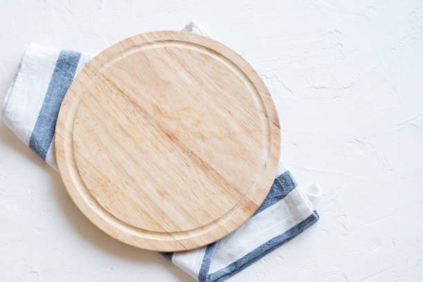istock wooden platter on white stone table 913622814