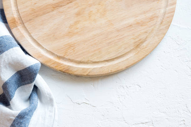 istock wooden platter on white stone table 913622848