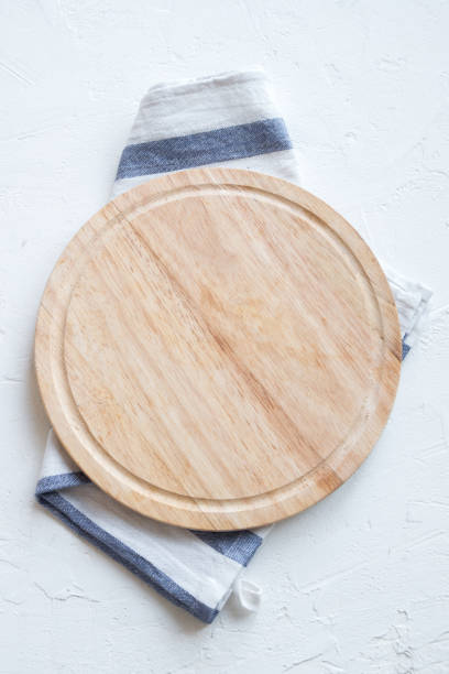 wooden platter on white stone table - pano de prato imagens e fotografias de stock