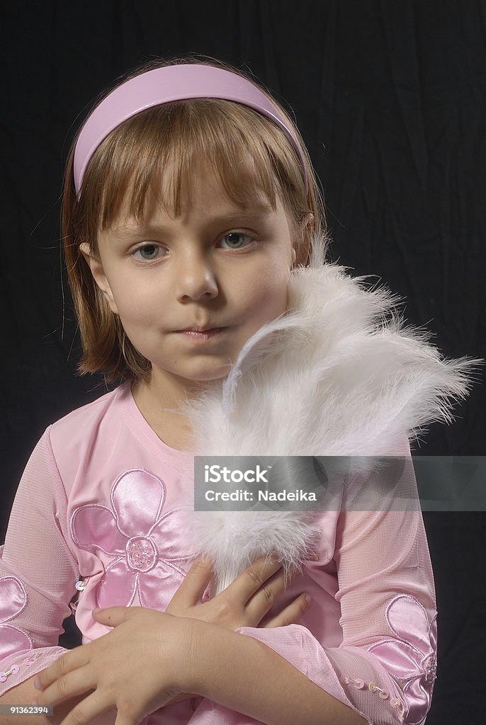 Ritratto di una bambina con ventilatore Piegato - Foto stock royalty-free di Adolescente