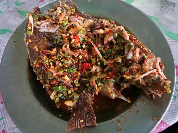 istock fried snapper with chili sauce on the plate 913630826