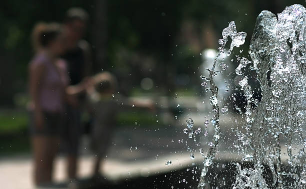 istock Family at a fountain 91363323