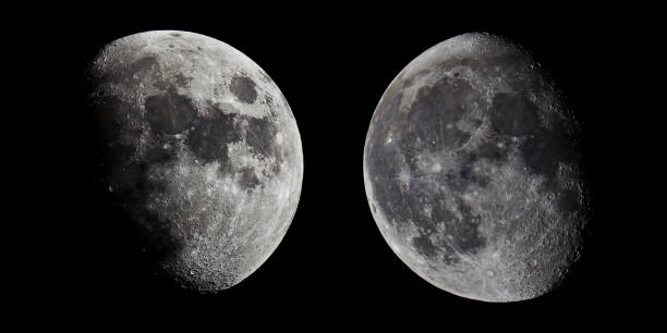 istock Half Moon in the middle of its way on the clear sky. 913638406