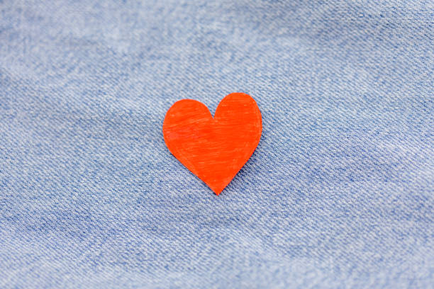 istock Paper red heart with Denim jeans texture background. Valentine Concept. Copy space 913638974