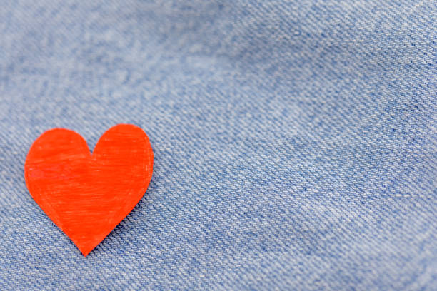 istock Paper red heart with Denim jeans texture background. Valentine Concept. Copy space 913639072