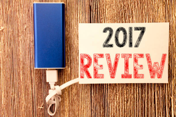 istock Conceptual hand writing text caption inspiration showing 2017 Review. Business concept for Annual Summary Report written on sticky note old wood wooden background with power bank 913644590