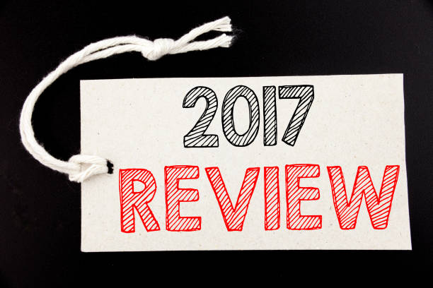 istock Handwritten text caption showing 2017 Review. Business concept writing for Annual Summary Report written on price tag paper on the black vintage background. 913645736