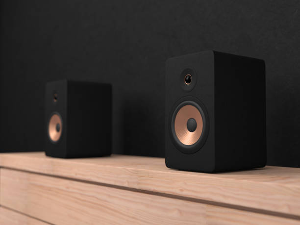 istock Black stereo Speakers with golden drivers on shelf 913649320
