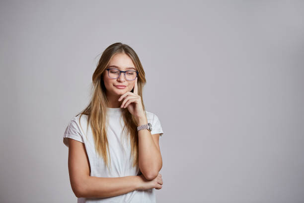 istock Thoughtful glasses girl 913649936