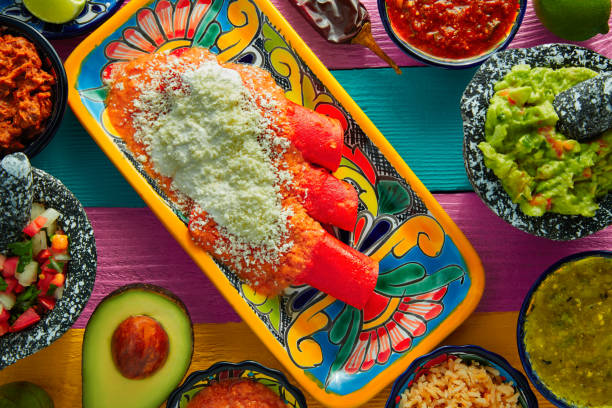 istock Red enchiladas Mexican food with guacamole 913650508