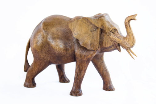 Bronze elephant figurine isolated on white background.