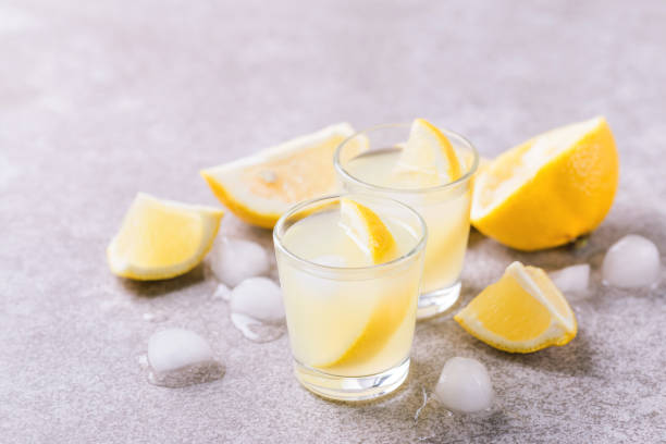 istock Italian lemon lime liqueur limoncello with ice and mint 913657504