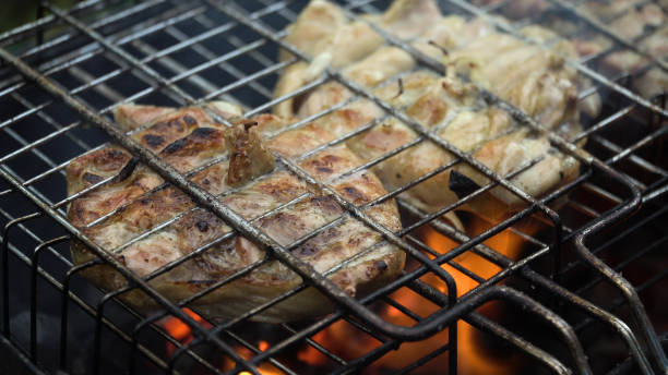 istock Grilled meat on the flaming grill 913657624