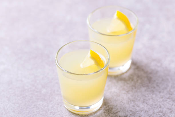 istock Italian lemon lime liqueur limoncello with ice and mint 913657634