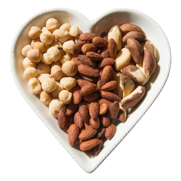 istock Roasted and Salted Macadamia Nuts & Almonds and Fresh Brazil Nuts 913661026