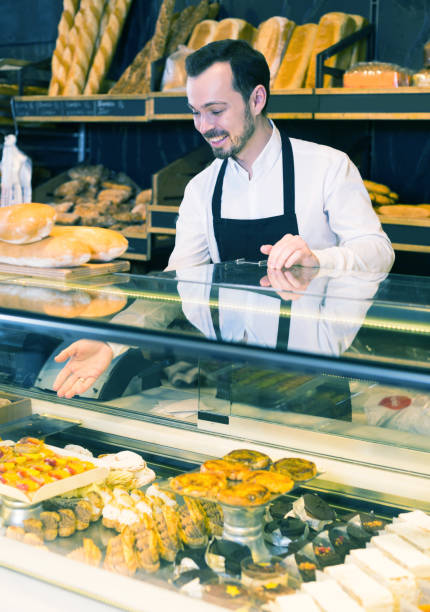 istock Seller offering fresh tasty bun 913661462