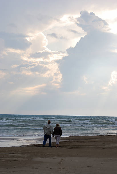 istock Mature Couple Walking on Beach 91366483