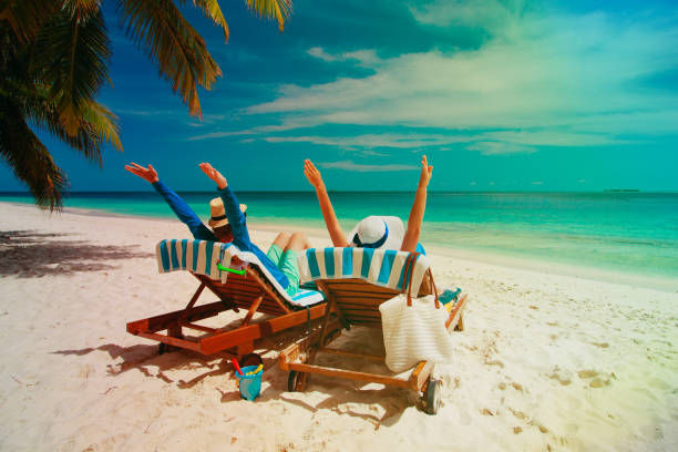 istock happy couple relax on a tropical beach 913664976