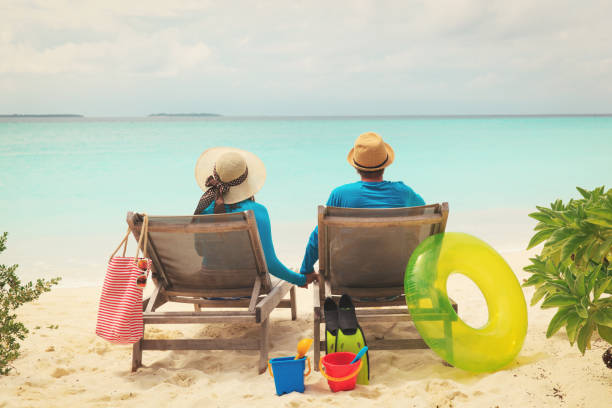 istock happy couple relax on a tropical beach 913665040
