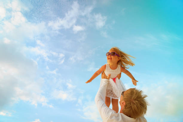 istock Father and little daughter play at sky 913665184