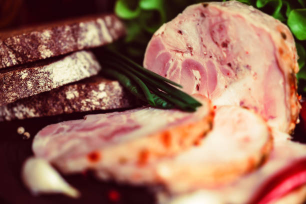 istock Sliced turkey roll, peppercorn and vegetables 913665474
