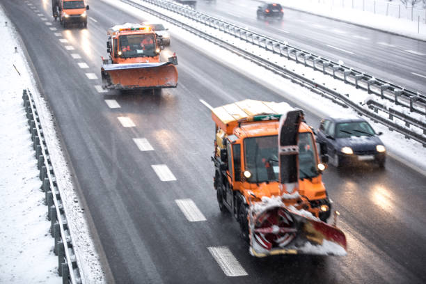 istock Snowplows in Traffic, Highway in Winter Conditions 913666574