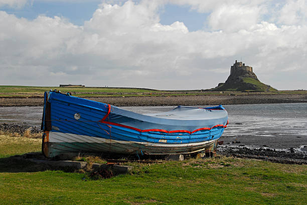 istock Harbour, boats and Lindisfarne Castle 91366904