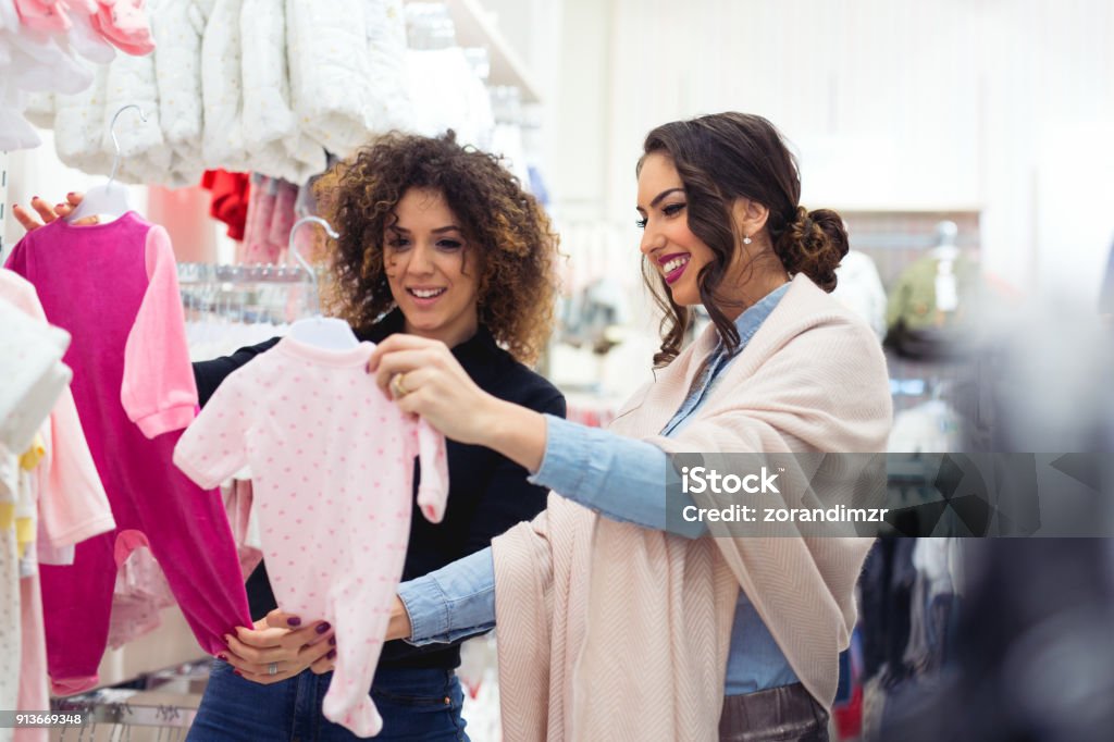 Woman buying baby sleep suit Shopping Stock Photo