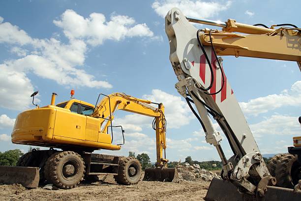 Two mechanical shovel on building site stock photo