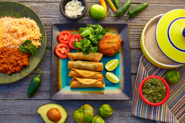 istock Mexican flautas rolled tacos with salsa 913672412