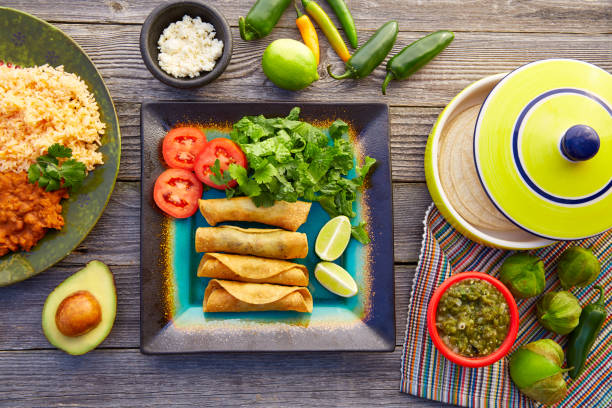 istock Mexican flautas rolled tacos with salsa 913672520
