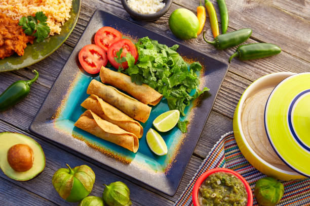 istock Mexican flautas rolled tacos with salsa 913673832