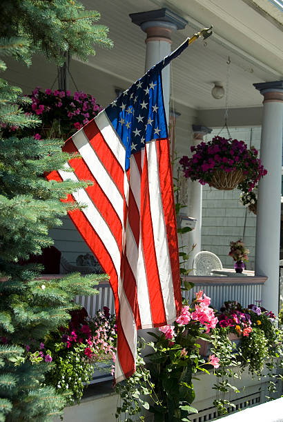 istock American flag hanging on white porch 91367608