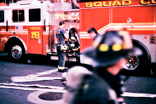 A group of New York City firefighters ready themselves for duty.