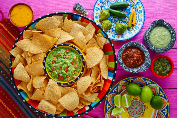 istock Nachos with guacamole tortilla chips sombrero 913678112