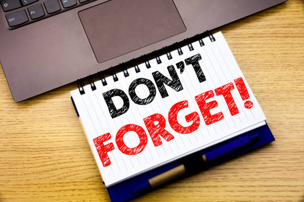 istock Hand writing text caption inspiration showing Do Not Forget. Business concept for Reminder Message written on notebook book on the wooden background in the Office with laptop 913678158