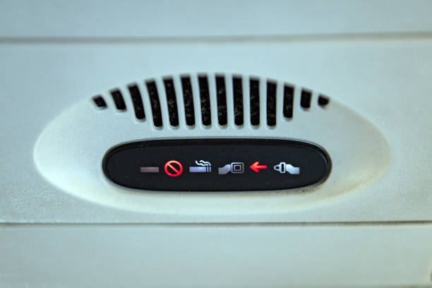 istock fasten seat belt on sign on airplane 913678796