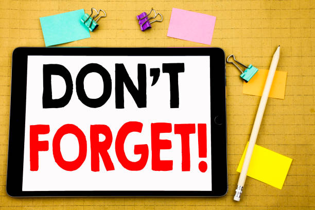 istock Hand writing text caption inspiration showing Do Not Forget. Business concept for Reminder Message Written on tablet laptop, wooden background with sticky note and pen 913679254
