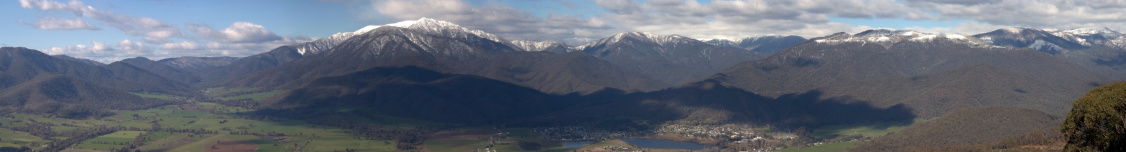 A panoramic image of the Australian Alps, and the Kiewa Valley in North East Victoria, Australia. Mount Bogong, second highest mountain in Australia, is centre left of frame. The township of Mount Beauty is at the base of the mountain range.