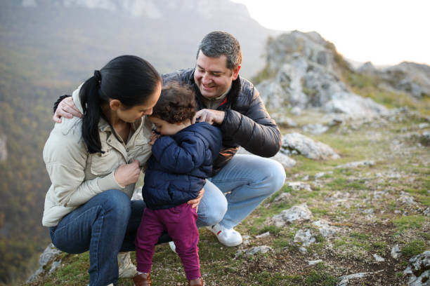 istock Happy family on mountain top 913681558